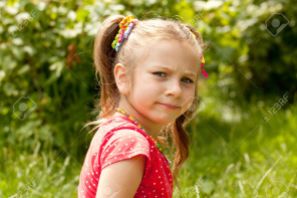 14824427-little-girl-in-a-red-blouse-for-someone-offended-stock-photo